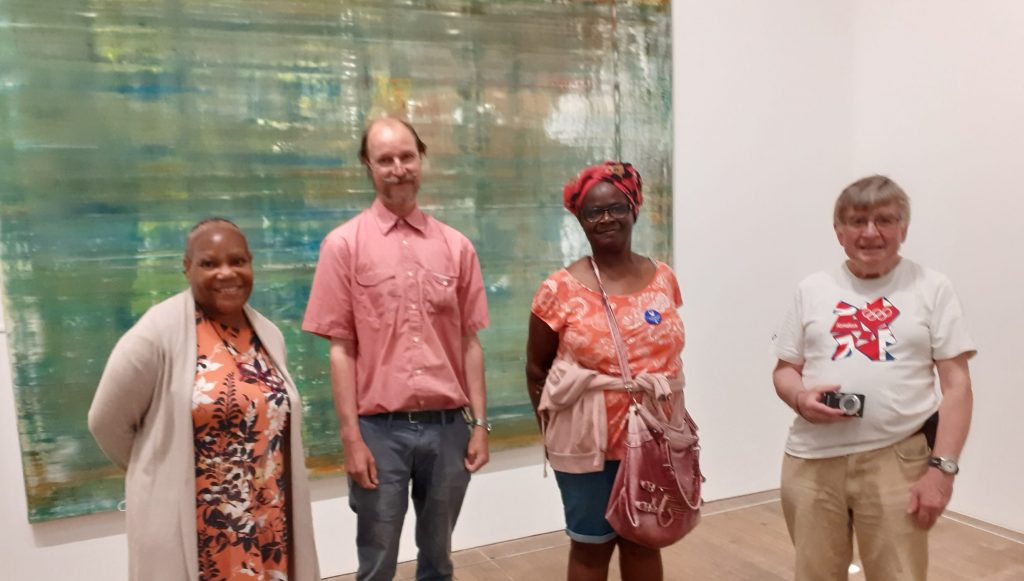 Four people in front of a painting at the Tate Moderni