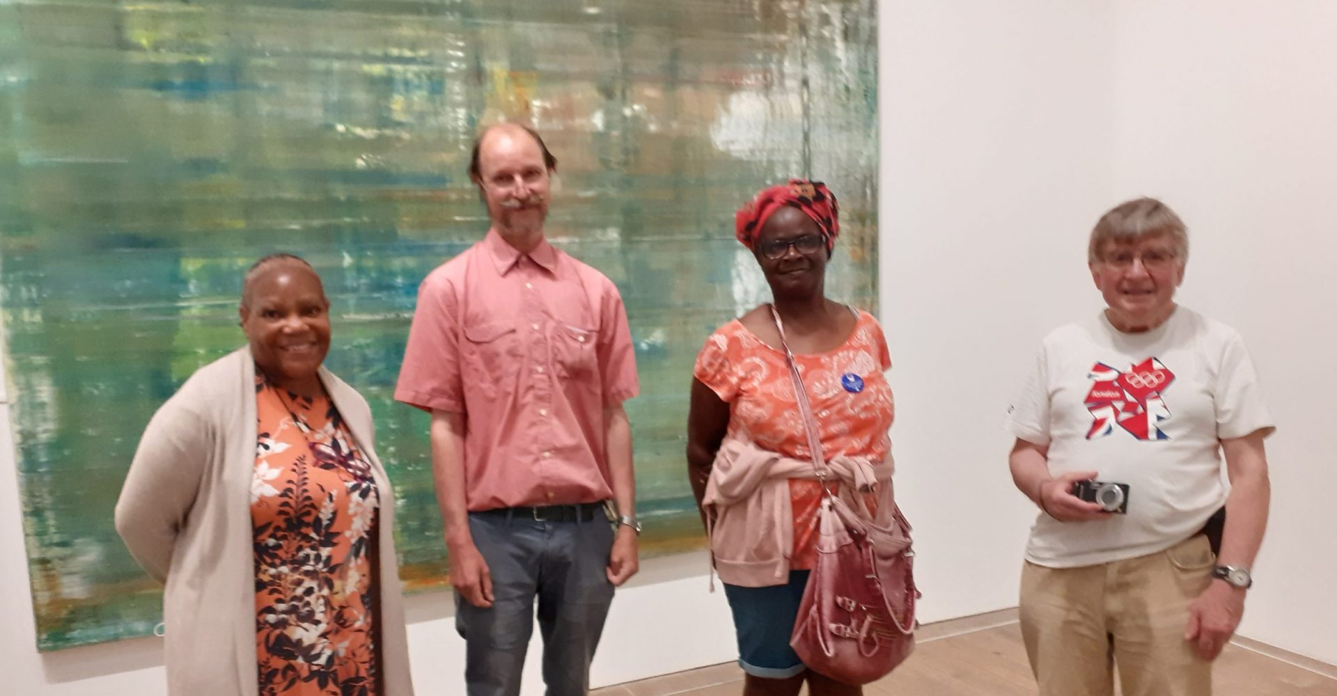 Four people in front of a painting at the Tate Moderni