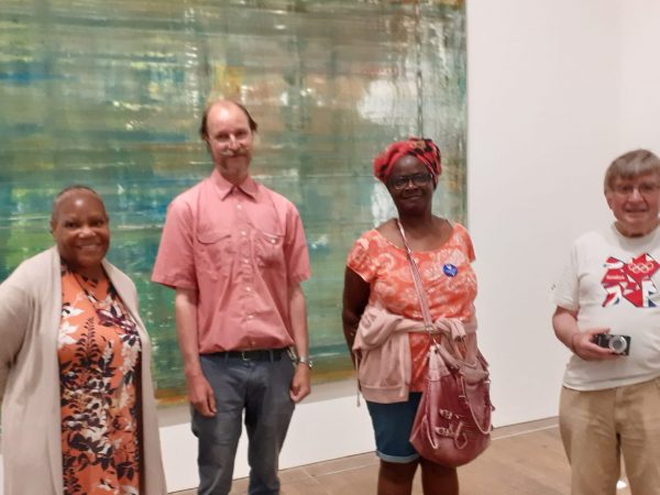 Four people in front of a painting at the Tate Moderni